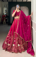 Rich Natural Silk with golden embroidery, glowing in vibrant pink elegance.