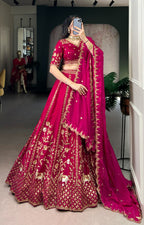 Rich Natural Silk with golden embroidery, glowing in vibrant pink elegance.