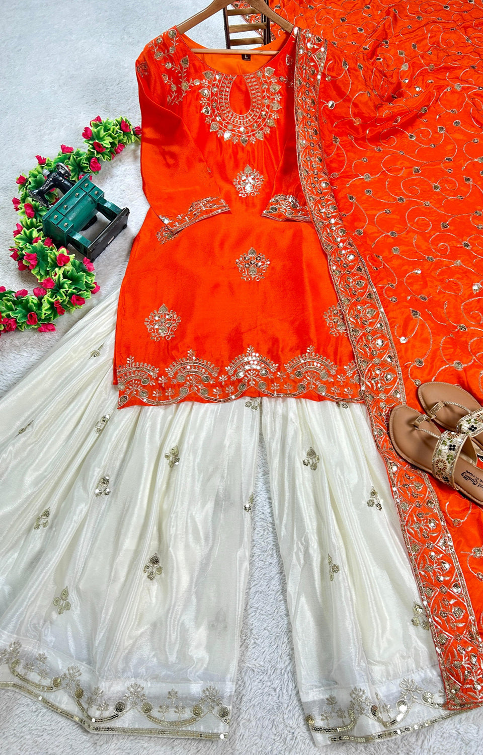 Vibrant Orange suit, contrasting garara, and stylish dupatta