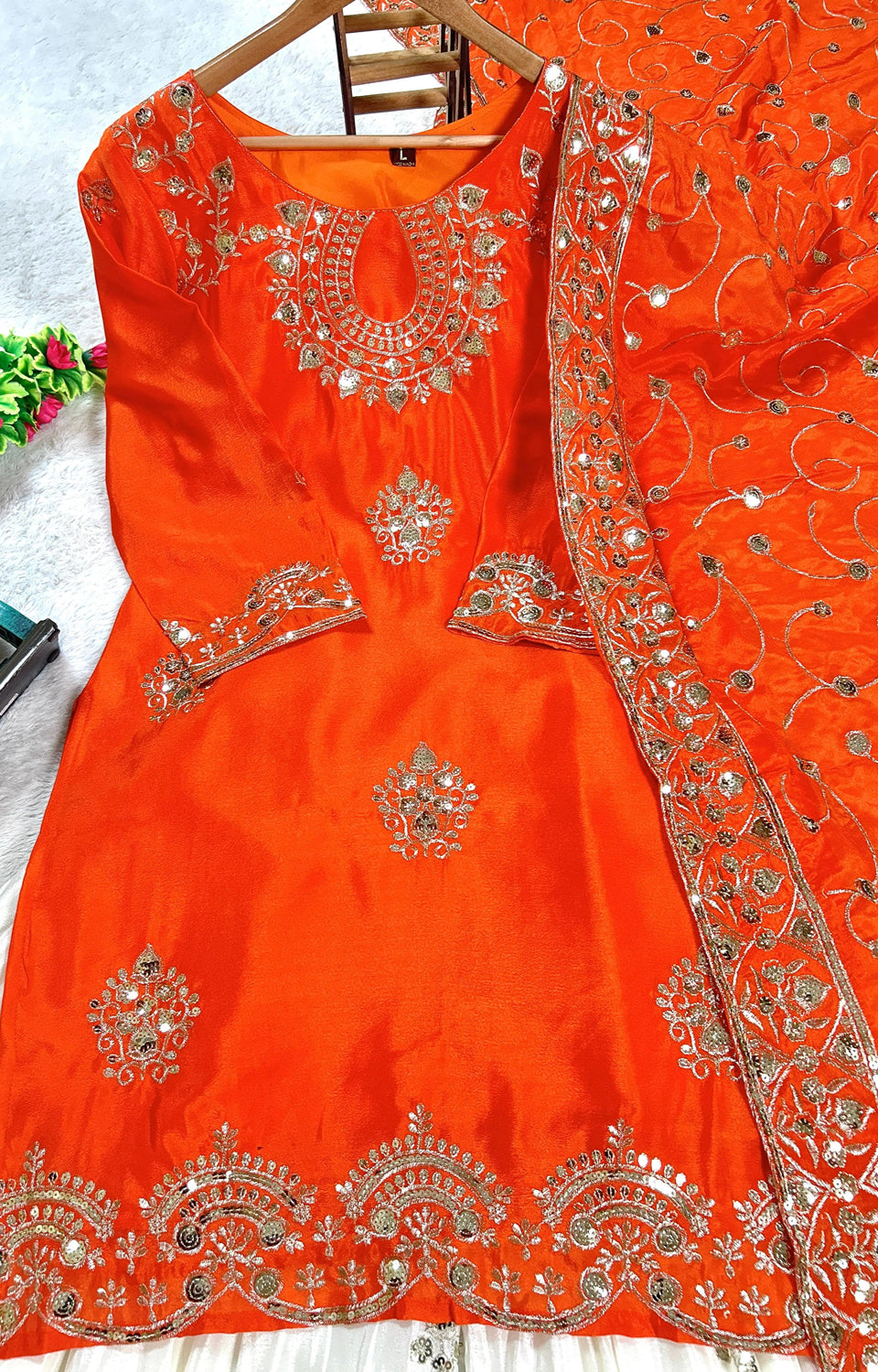 Vibrant Orange suit, contrasting garara, and stylish dupatta