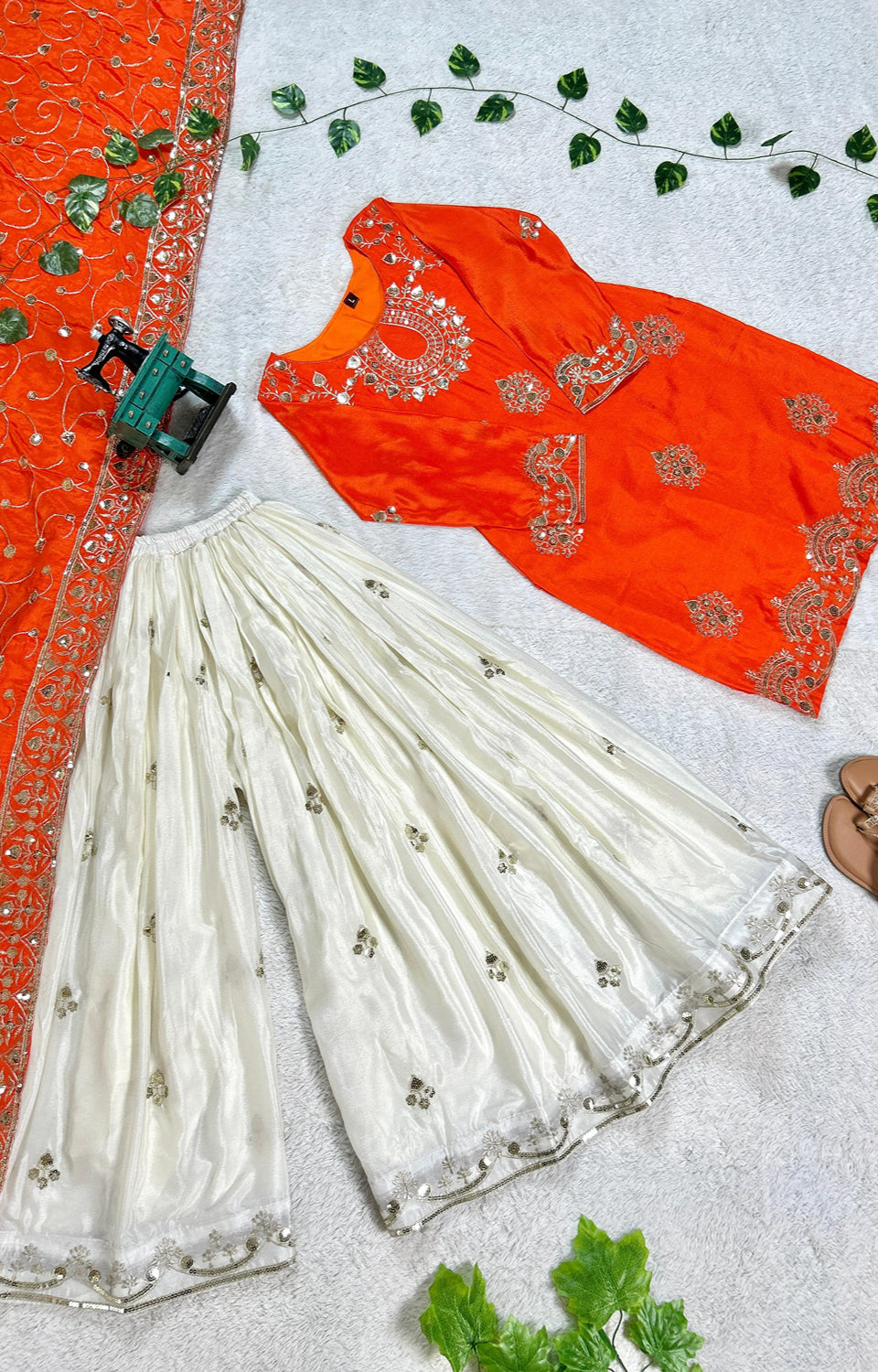 Vibrant Orange suit, contrasting garara, and stylish dupatta